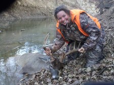 Candy and her river buck. This beute fell in the river and gave us a real tussle!!!